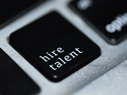 A computer keyboard key with "hire talent" as the label.